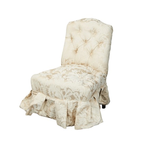 502 - A VINTAGE BUTTONED UPHOLSTERED SLIPPER CHAIR, covered in a champagne coloured damask material, with ... 