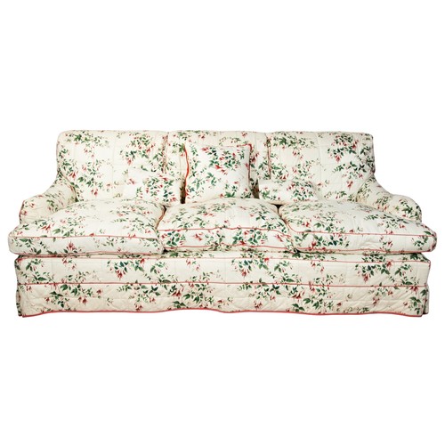 507 - A PORTMAN UPHOLSTERY THREE SEAT CALICO SETTEE, 20TH CENTURY, by Colefax and Fowler, with a cream col... 