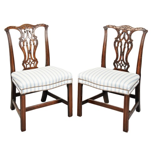 512 - A PAIR OF MAHOGANY SIDE CHAIRS IN THE CHIPPENDALE MANNER, 19TH CENTURY with ornately carved pierced ... 