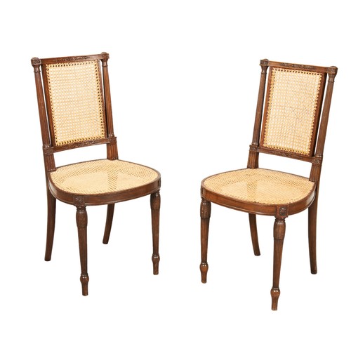 523 - A PAIR OF LOUIS XVI STYLE MAHOGANY SIDE CHAIRS raised on stiff leaf carved reeded front supports 90c... 