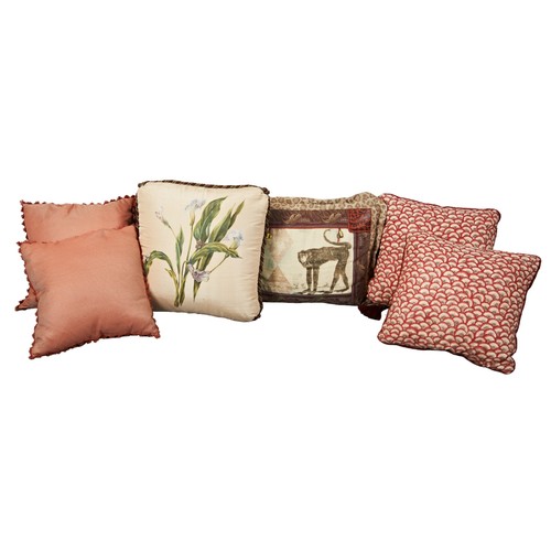 603 - A GROUP OF SIX THROW CUSHIONS consisting of a pair of sateen scarlet and peach shell cushions, a lea... 