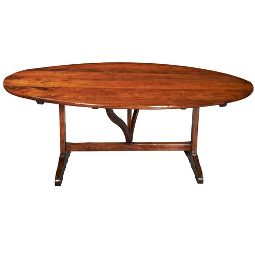 537 - AN OVAL TOP TILTING CONTINENTAL FRUIT WOOD COUNTRY TABLE The oval form plank top raised on a refecto... 