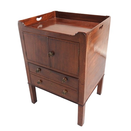 553 - A MAHOGANY NIGHT COMMODE, 19TH CENTURY three quarter tray top above twin cupboard doors with drawer ... 