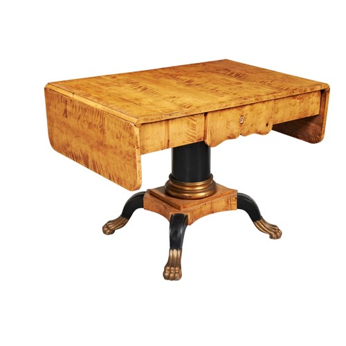 567 - A BIEDERMEIER MAPLE SOFA TABLE, 19TH CENTURY Rectangular top with two hunger leaves above a short fr... 