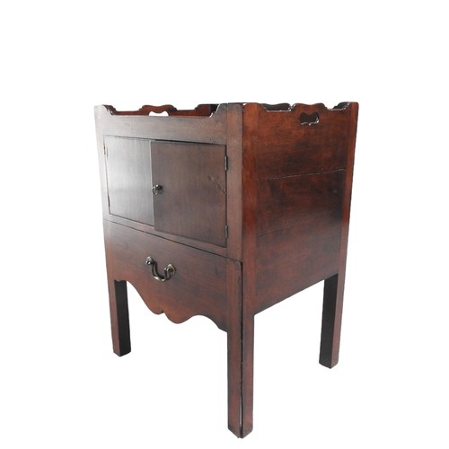 572 - MAHOGANY GALLERY TOP COMMODE, EARLY 19TH CENTURY three quarter galleried tray top above two cupboard... 