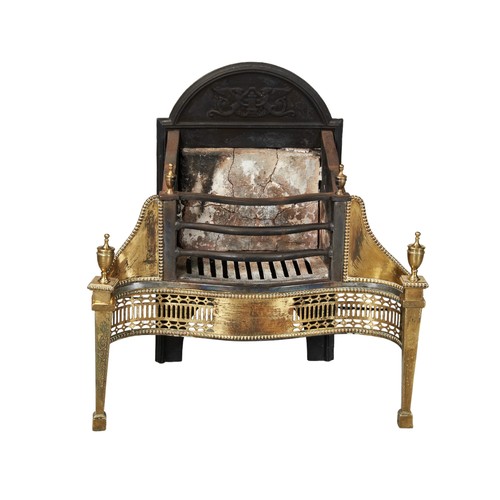 587 - AN ADAMS STYLE CAST-IRON FIRE PLACE, EARLY 20TH CENTURY, with arch top cast iron fire back with serp... 