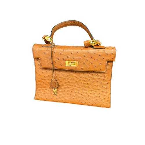 787 - BALENCIAGA TAN OSTRICH SKIN HANDBAG Two small pockets (one with zip) within main compartment. With p... 