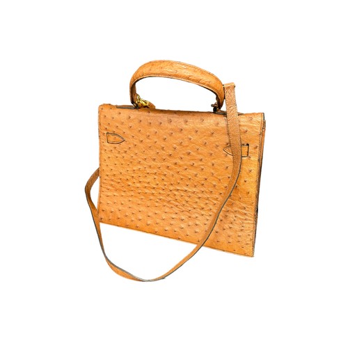 787 - BALENCIAGA TAN OSTRICH SKIN HANDBAG Two small pockets (one with zip) within main compartment. With p... 