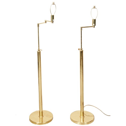 626 - A PAIR OF 'BILLY BALDWIN' BRASS FLOOR LAMPS, 20TH CENTURY, with adjustable pivoting arms133cm High (... 