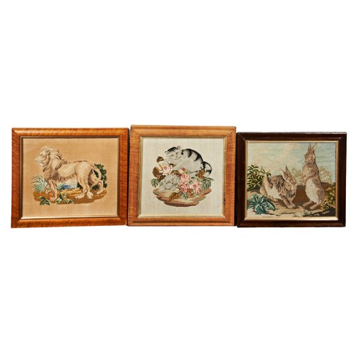 681 - A GROUP OF THREE VICTORIAN NEEDLEWORK PICTURES CIRCA 1870 depicting lion, rabbits and cats. Glazed a... 