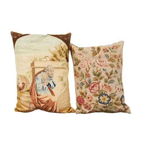 610 - TWO RECTANGULAR NEEDLEPOINT CUSHIONS one depicting a kneeling saint holding a key in a farmyard scen... 