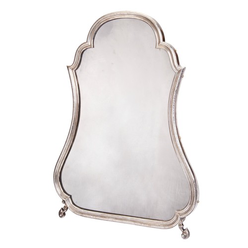 644 - A GEORGE II SILVER DRESSING TABLE MIRROR, cartouche form with later walnut easel back and later plat... 