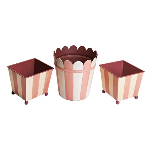 591 - COLEFAX AND FOWLER PINK STRIPED TOLE CACHEPOT WITH TWO COLEFAX AND FOWLER TOLE PLANTERS The planters... 