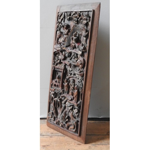 219 - A JAPANESE CARVED HARDWOOD PANEL, the panel carved in high relief, depicting numerous figures and an... 