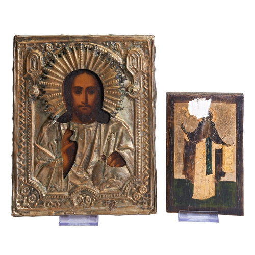 407 - A BRASS EMBOSSED ICON PANEL, and a smaller panel