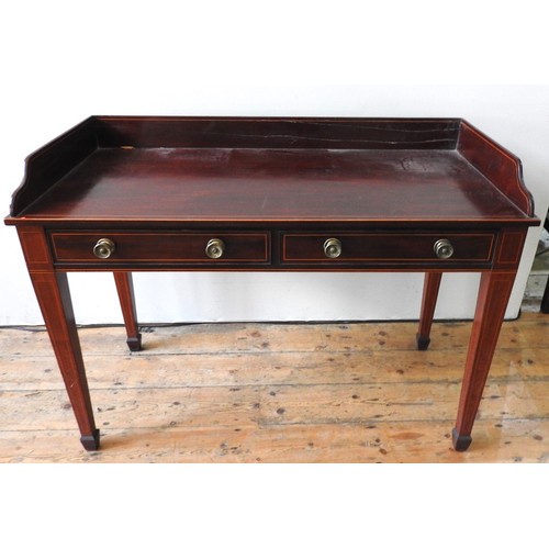 25 - A MAHOGANY TWO DRAWER WASH STAND, rectangular top with three quarter gallery over two short frieze d... 