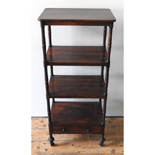 11 - A VICTORIAN ROSEWOOD WHATNOT, the four tiers united by turned pillar supports, the bottom tier with ... 