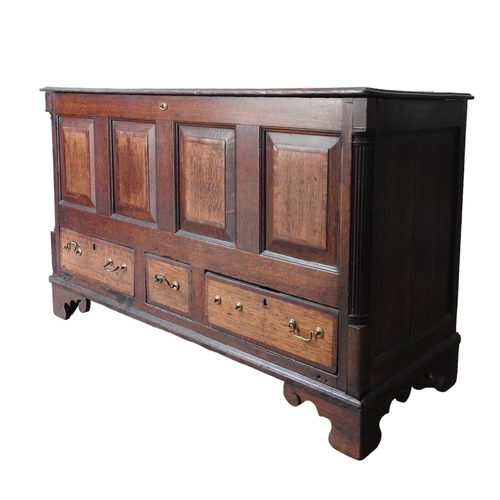 26 - AN OAK AND MAHOGANY CROSS BANDED MULE CHEST, 19TH CENTURY, hinged rectangular top over panelled frie... 