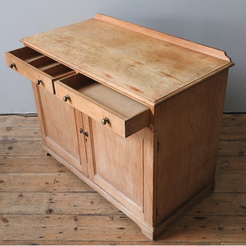 38 - A WAXED PINE CUPBOARD, LATE 19TH CENTURY, gallery back rectangular top over two short frieze drawers... 