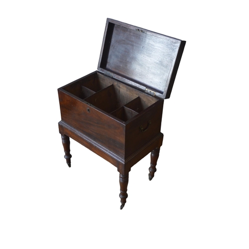 37 - A MAHOGANY CELLARETTE, 19TH CENTURY, the hinged rectangular top opening to reveal a compartmented in... 