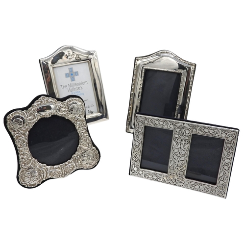 445 - A GROUP OF FOUR SILVER MOUNTED PHOTOGRAPH FRAMES, the lot includes two arch top rectangular frames, ... 