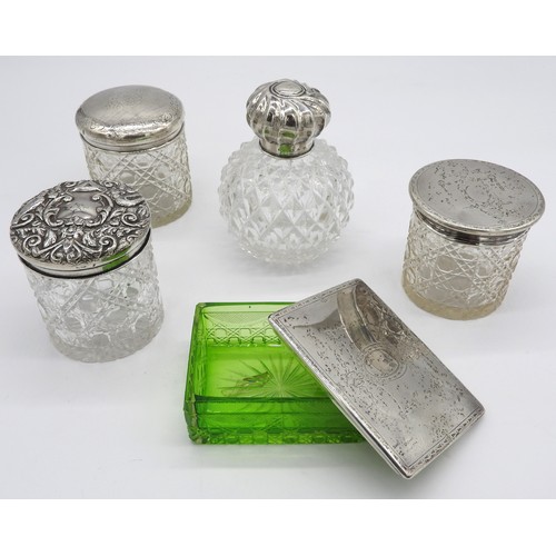 446 - A SILVER MOUNTED CUT GLASS SCENT BOTTLE, THREE SILVER LIDDED JARS AND A SILVER LIDDED BOX, the scent... 