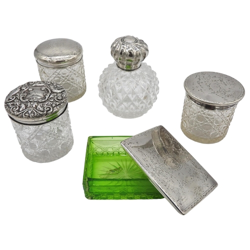 446 - A SILVER MOUNTED CUT GLASS SCENT BOTTLE, THREE SILVER LIDDED JARS AND A SILVER LIDDED BOX, the scent... 