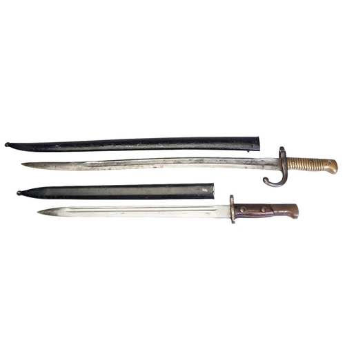 164 - A FRENCH AND A GERMAN BAYONET, BOTH IN CASES