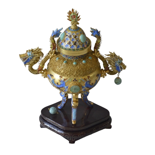224 - AN ORNATE CHINESE GILT METAL INCENSE BURNER, cloisonne decorated sides and legs, flanked by twin dra... 