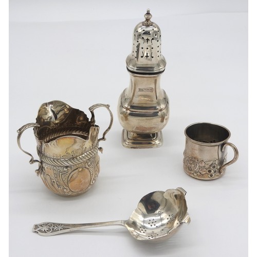 454 - A MIXED GROUP OF SILVER WARES, the lot includes a sugar sifter (Birmingham 1919), a christening mug ... 