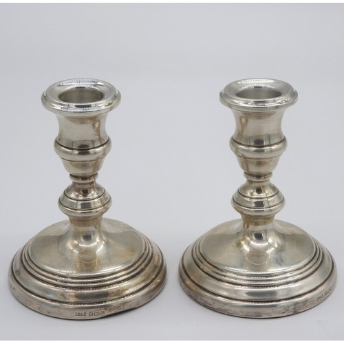 450 - A PAIR OF VINTAGE WEIGHTED SILVER CANDLESTICKS, knopped stem columns on a spreading circular foot, m... 