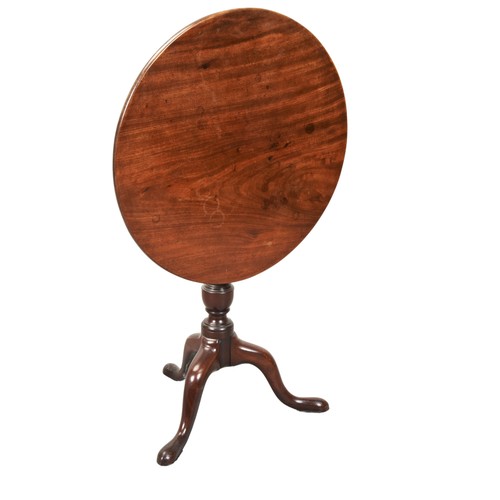 28 - A MAHOGANY TRIPOD TABLE, 19TH CENTURY, tilting circular top on a baluster turned column, raised on t... 