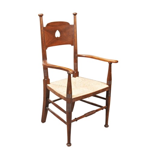 18 - A WILLIAM BIRCH ARTS & CRAFTS ELBOW CHAIR, EARLY 20TH CENTURY, constructed from ash, panel back ... 