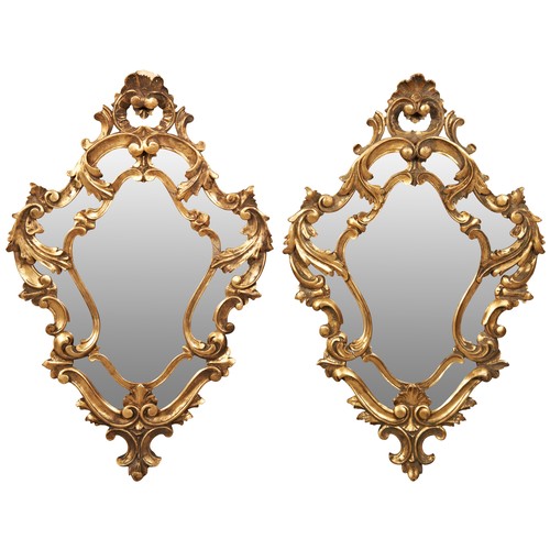 212 - A PAIR OF ROCOCO STYLE WALL MIRRORS, 19TH CENTURY, cartouch form, with ornate scroll foliate and roc... 