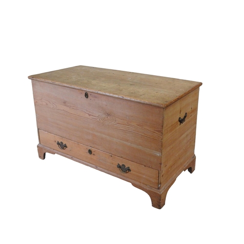 99 - A WAXED PINE MULE CHEST, 19TH CENTURY, with hinged rectangular top and long frieze drawer, raised on... 