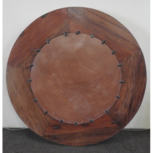124 - A LARGE CIRCULAR INDIAN WALL MIRROR, constructed from reclaimed timber122 cm diamProvenance: Propert... 