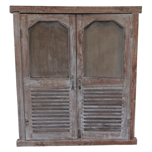 110 - A PAIR OF INDIAN LIMED HARDWOOD LOUVRE SHUTTER DOORS, with mesh inset panels142 x 130 cmProvenance: ... 