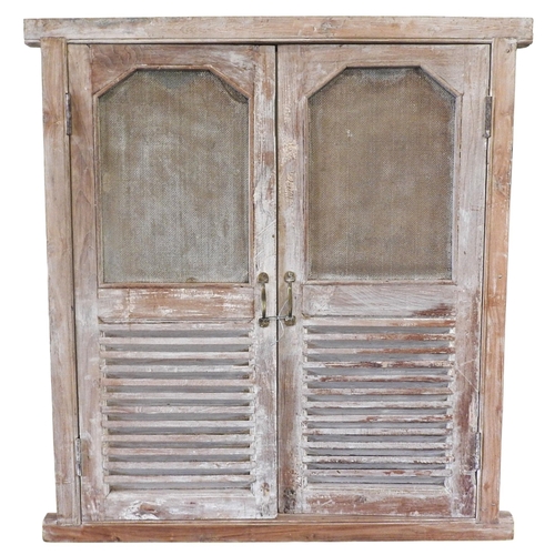 108 - A PAIR OF INDIAN LIMED HARDWOOD LOUVRE SHUTTER DOORS, with mesh inset panels142 x 130 cmProvenance: ... 