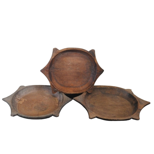 86 - A GROUP OF THREE INDIAN HARDWOOD CIRCULAR PARATH DISHES52 cm diamProvenance: Property of a long esta... 