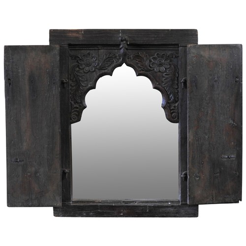 120 - AN INDIAN HARDWOOD FRAMED MIRROR, the  plate enclosed by two iron mounted doorsProvenance: Property ... 