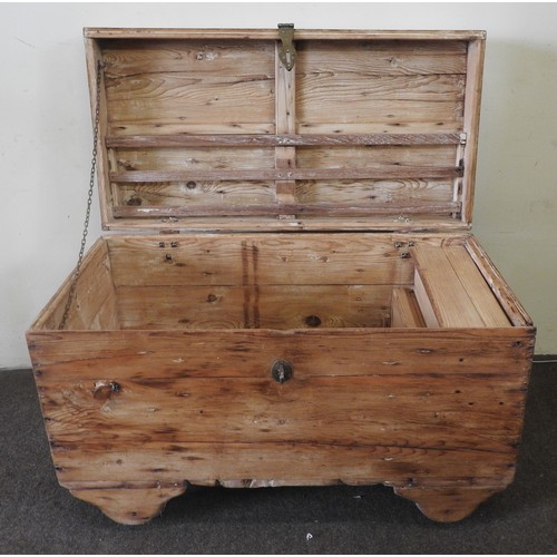 102 - A RUSTIC PINE BLANKET CHEST, raised on wooden casters62 x 96 x 60 cmProvenance: Property of a long e... 