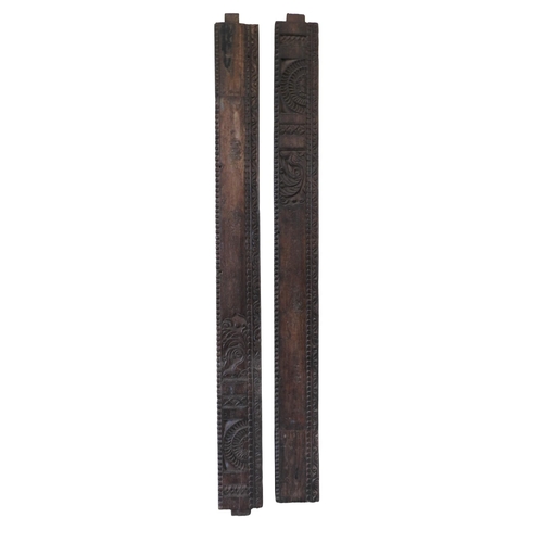 72 - TWO LONG CARVED INDIAN HARDWOOD PANELS, with scroll foliate carved decoration209 cm longProvenance: ... 