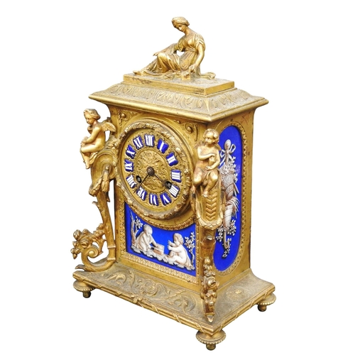 200 - A FRENCH 19TH CENTURY ORMOLOU CASED MANTEL CLOCK, the 7 cm embossed gilt dial with enamel numerals a... 