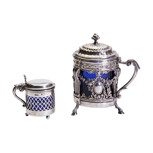 441 - AN ORNATE CONTINENTAL SILVER MUSTARD POT, with fluted cushion form cover, scroll handle and hood fee... 