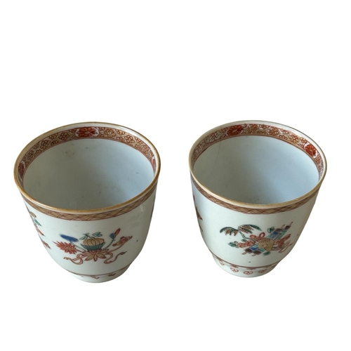 296 - A PAIR OF FAMILLE ROSE CUP18TH CENTURY decorated with auspicious symbols and floral motifs.... 