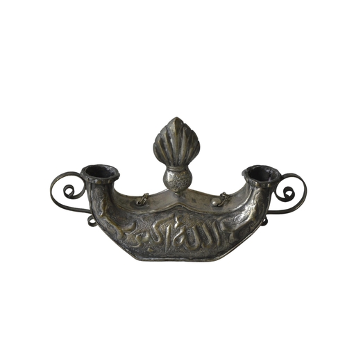 216 - A PERSIAN WHITE METAL CANDLE HOLDER, EARLY 20TH CENTURY, surmounted by a central finial with two scr... 