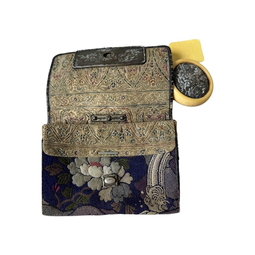 221 - A JAPANESE EMBROIDERY CASE19/20TH CENTURY decorated with lion and flowers, with a silver chain.Prove... 