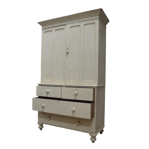 29 - A MID VICTORIAN PAINTED PINE LINEN PRESS, in two sections, with a moulded cornice over a pair of dua... 
