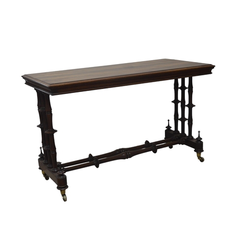 23 - A ROSEWOOD CONSOLE TABLE, EARLY 19TH CENTURY, the rectangular moulded edge topraised on end supports... 