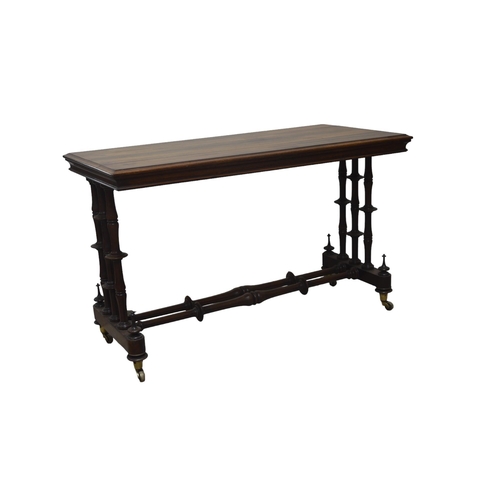 23 - A ROSEWOOD CONSOLE TABLE, EARLY 19TH CENTURY, the rectangular moulded edge topraised on end supports... 